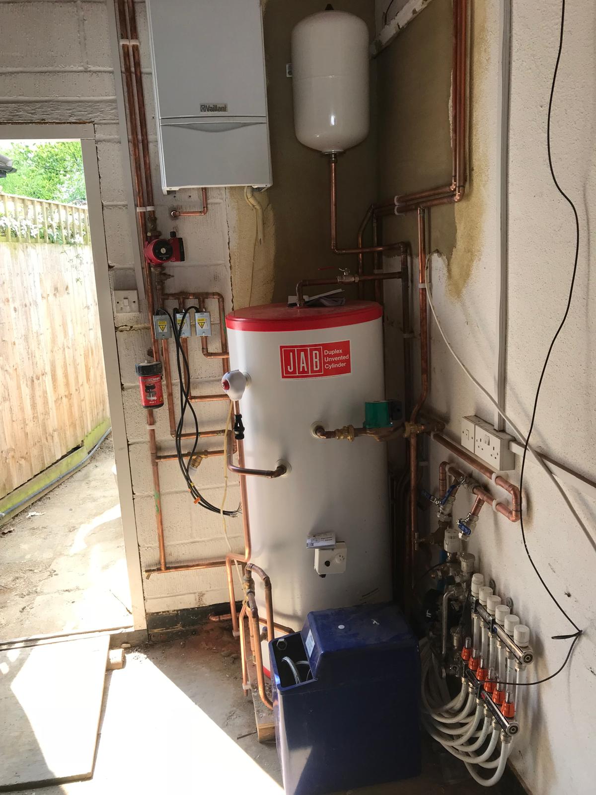 Vaillant boiler and JAB unvented cylinder installed in a garage plant space