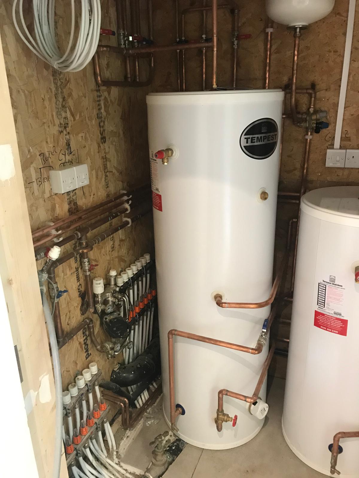 Unvented hot water cylinder with copper primaries and underfloor heating manifold