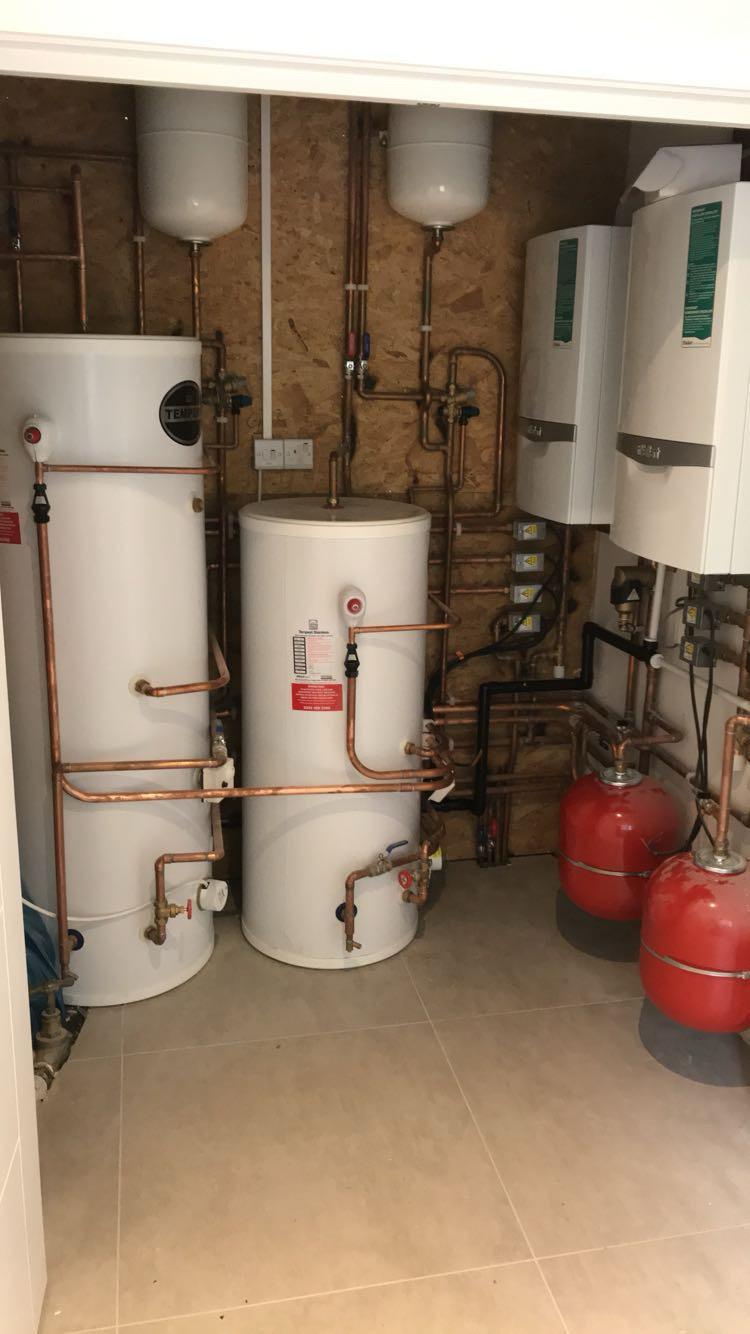 Full plant room with two Vaillant boilers, twin unvented cylinders and expansion vessels