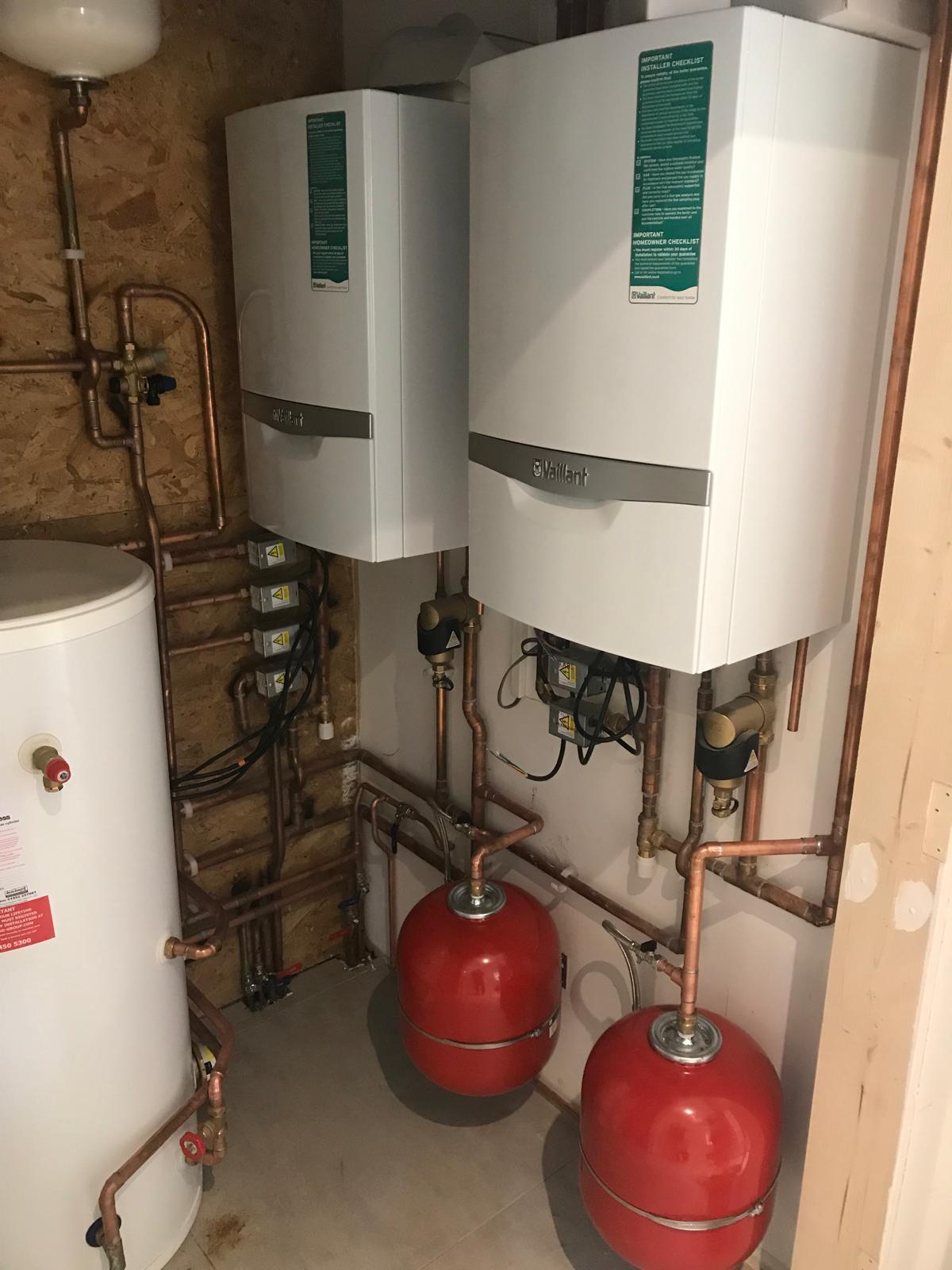 Vaillant boiler installation with unvented cylinder and red expansion vessels